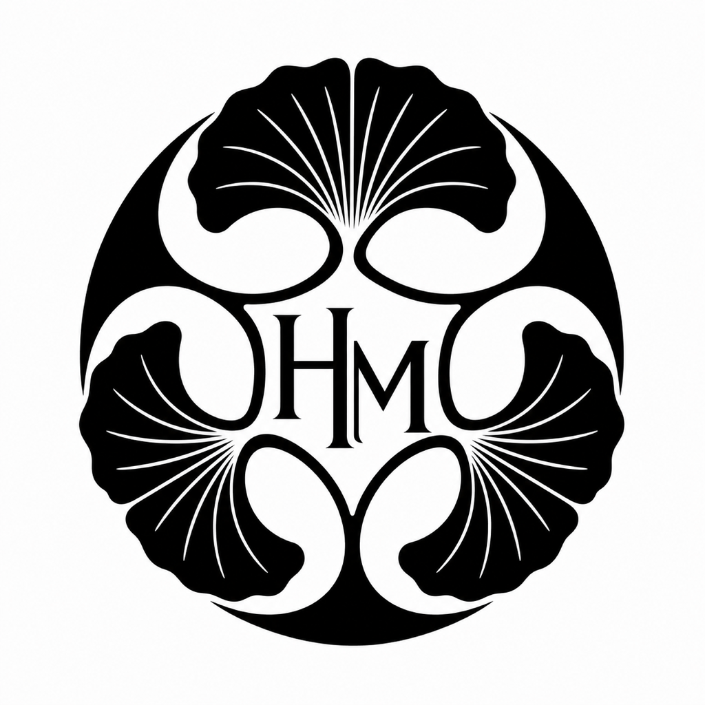 Black and white kamon-inspired family symbol with ginkgo leaves and HM initials