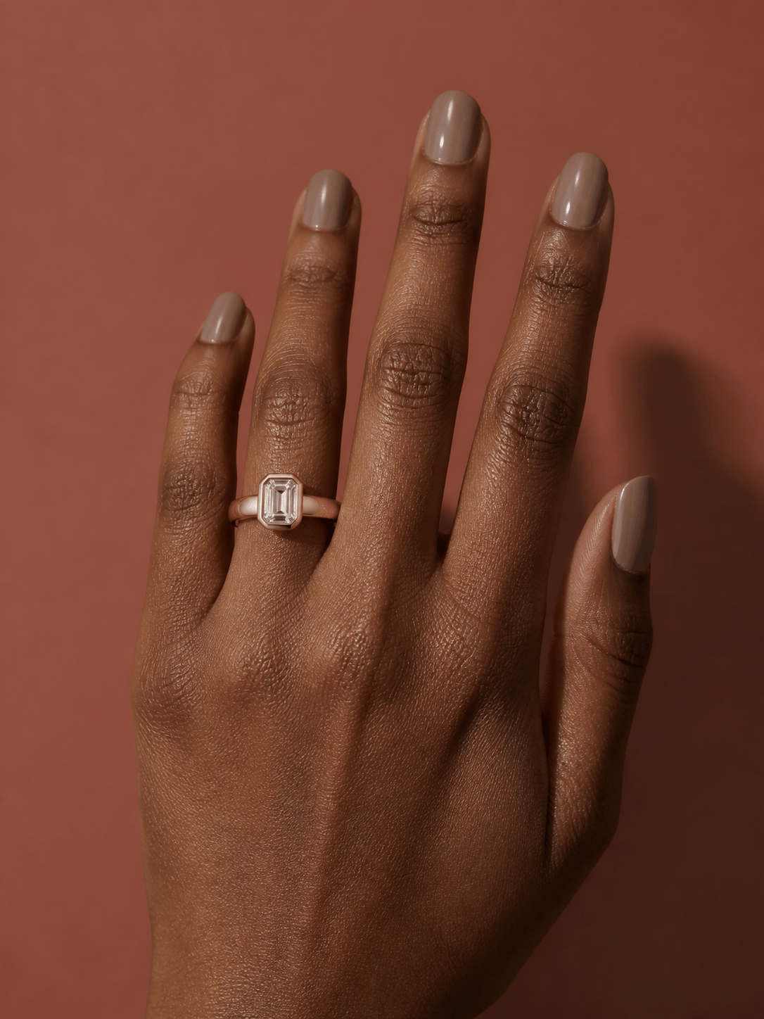Virtual ring try on with an emerald-cut rose gold ring